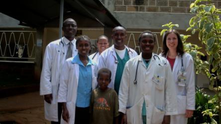 Dr. Pfister and clinical staff, lined up in lab coats