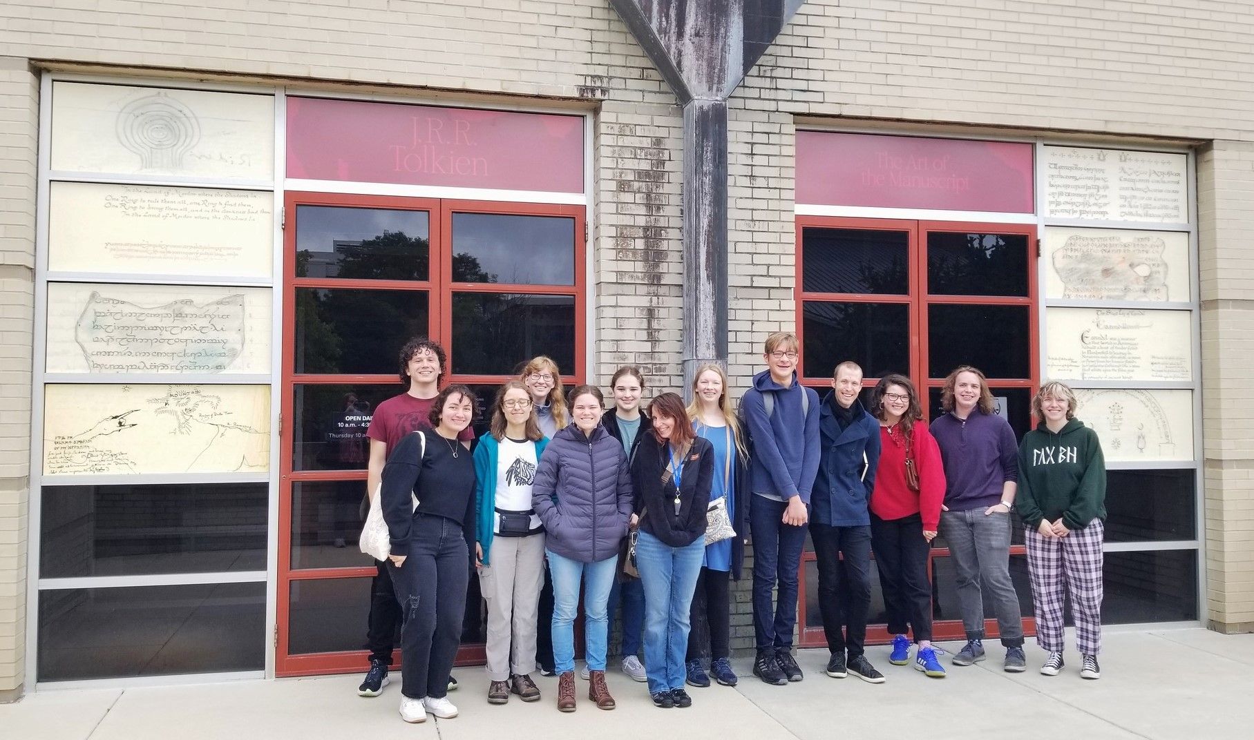 Group of people in front of the Tolkien manuscripts exhibition building