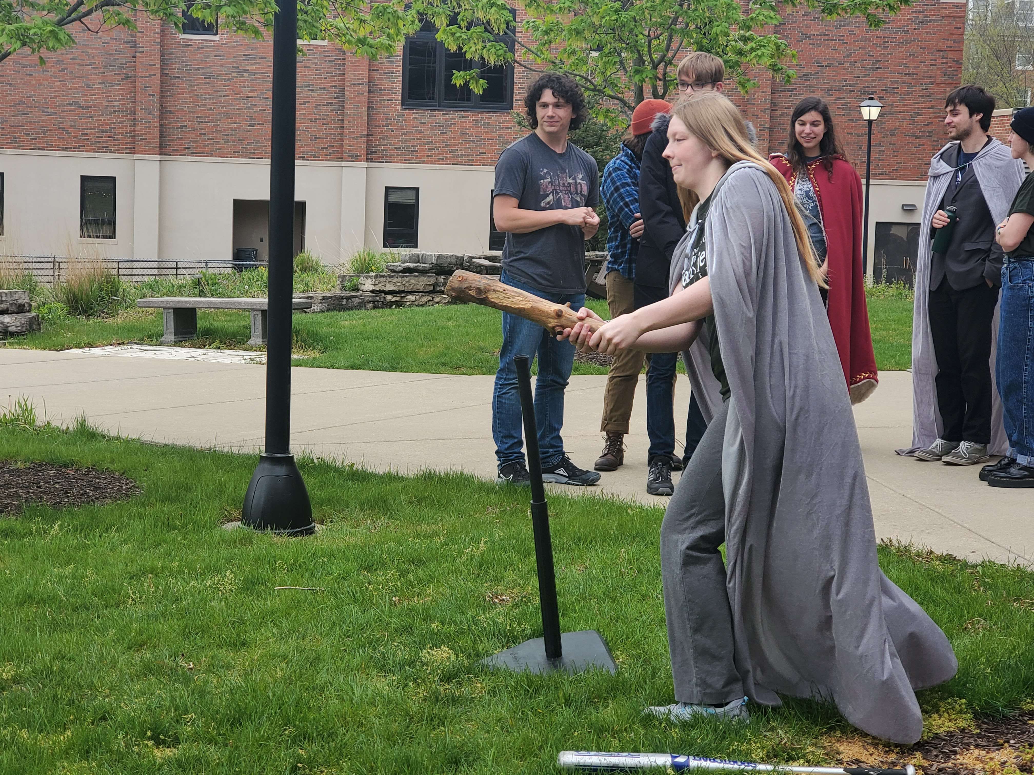 Girl hitting an orc head with a cudgel