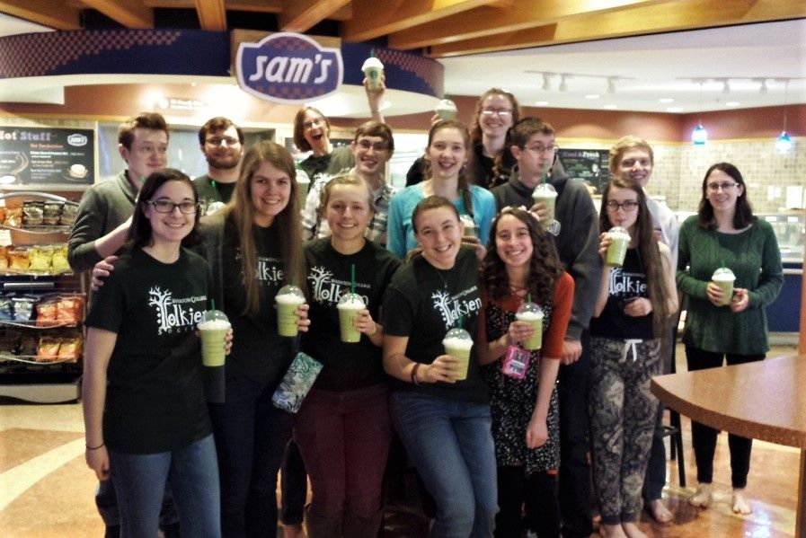 Group holding up matcha beverages