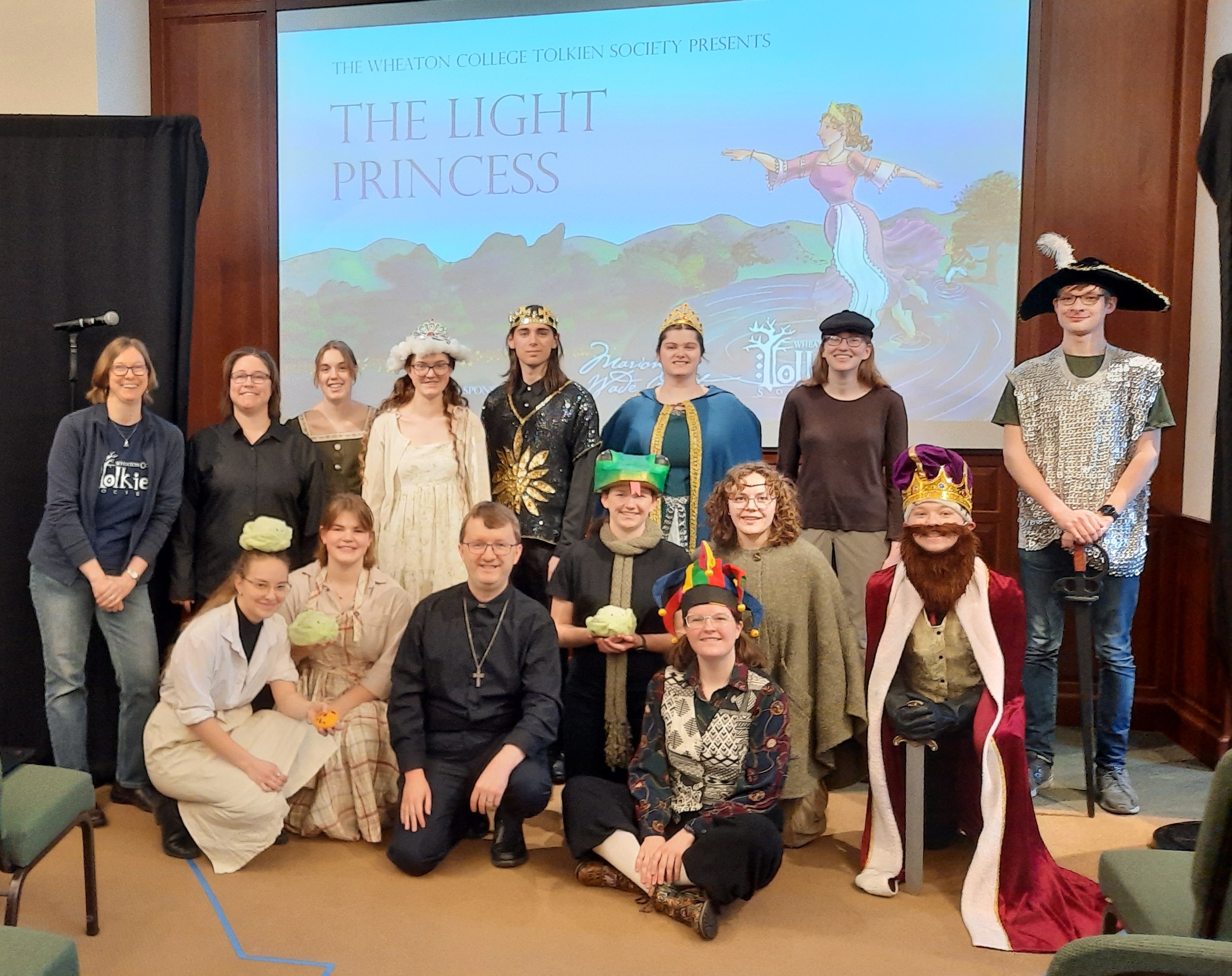 People in costumes in an auditorium