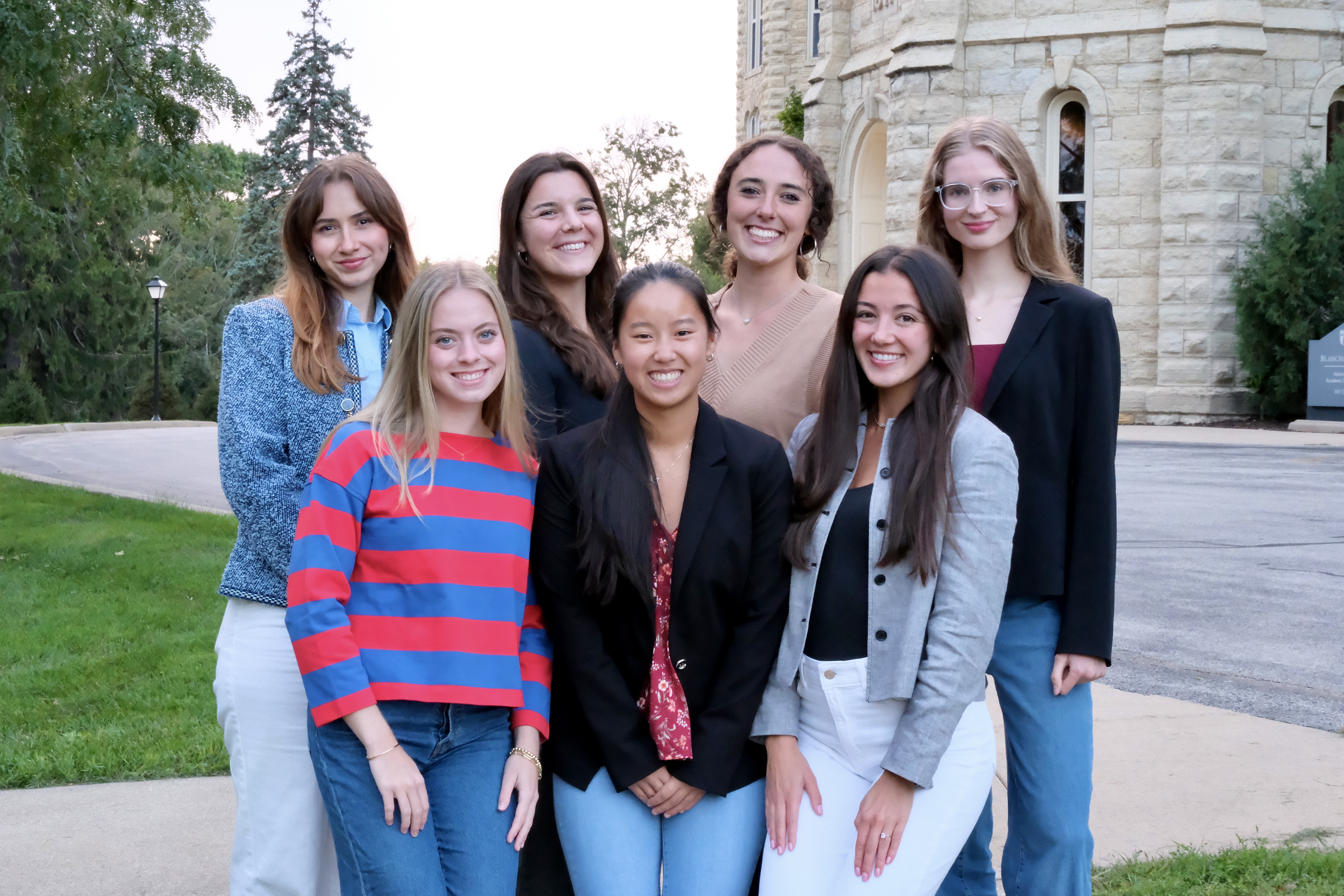 women students group standing in front of Blanchard
