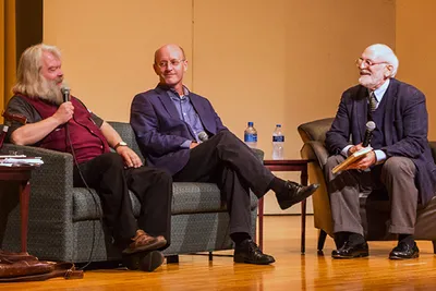 Three men talking Three men talking