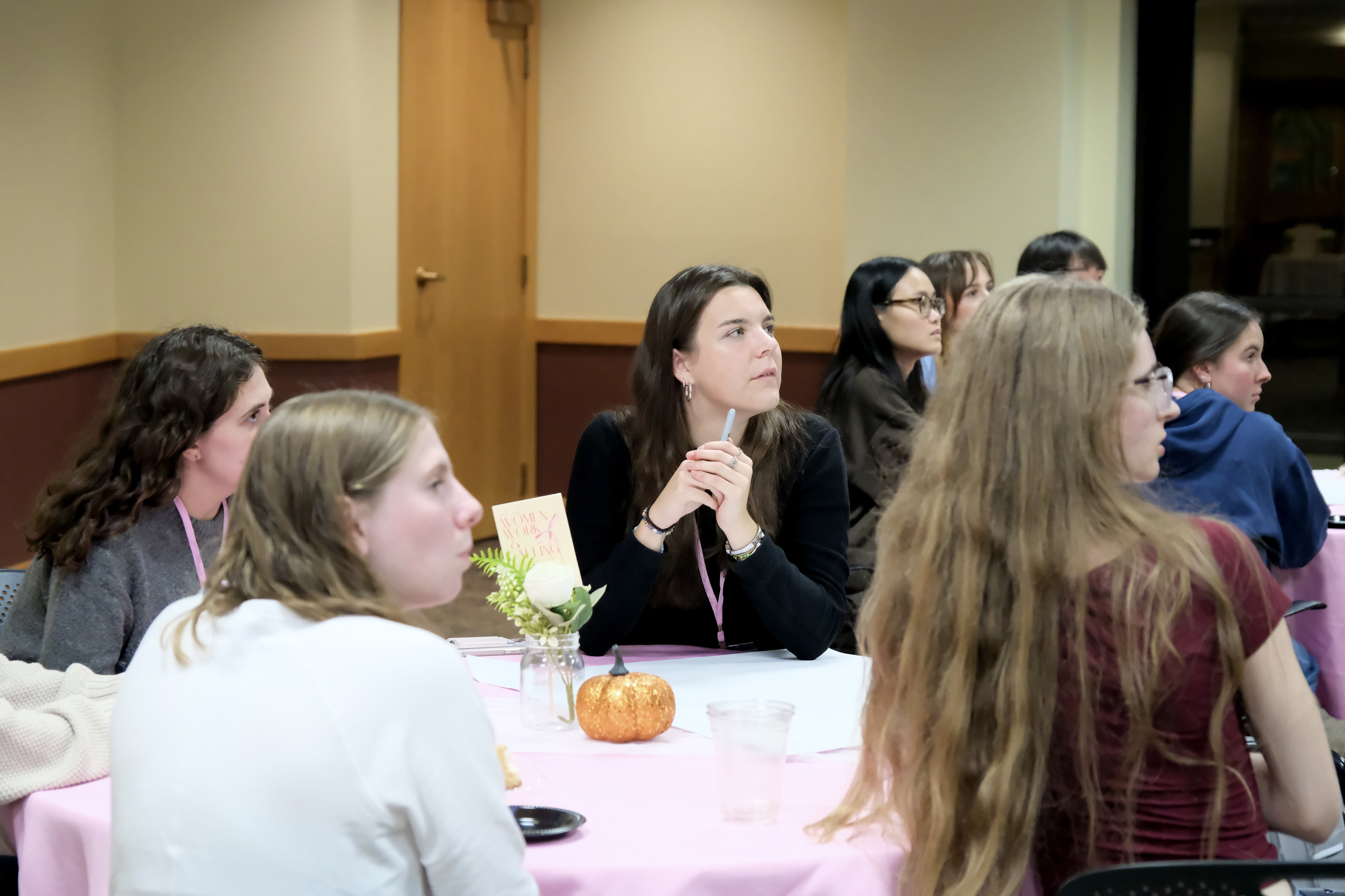 student listening to speaker