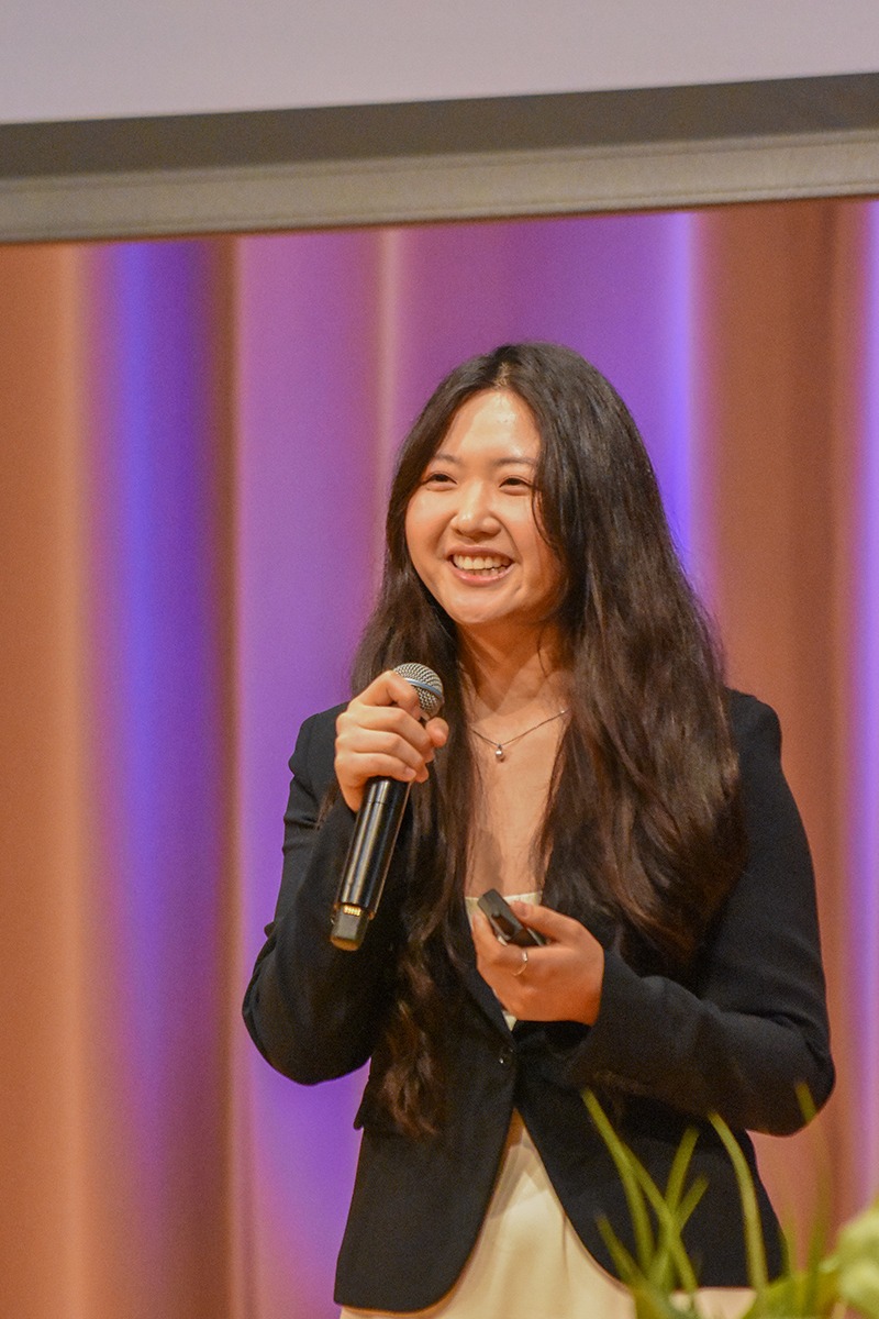 female presenter smiling