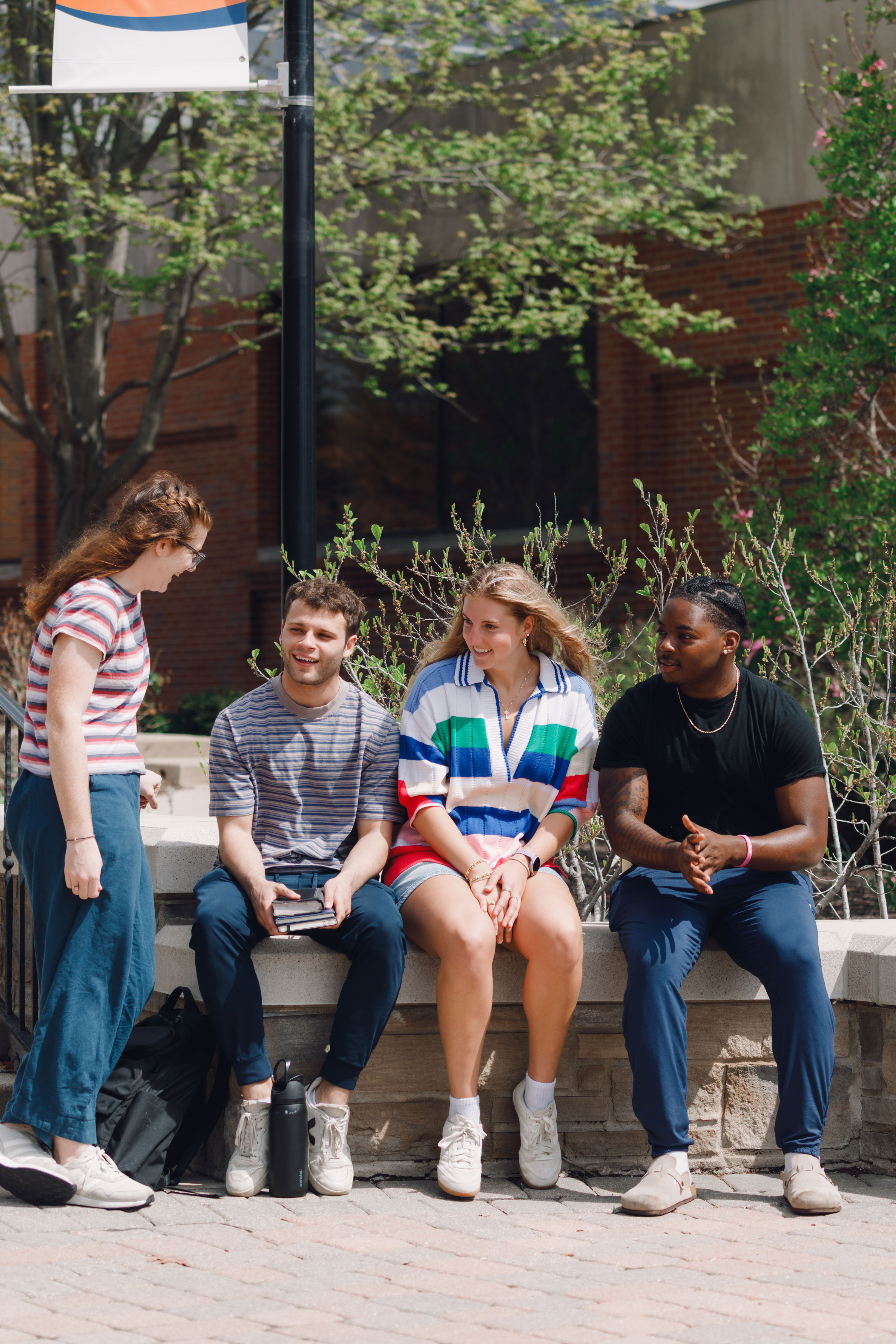 Four Wheaton College Students Outside Talking