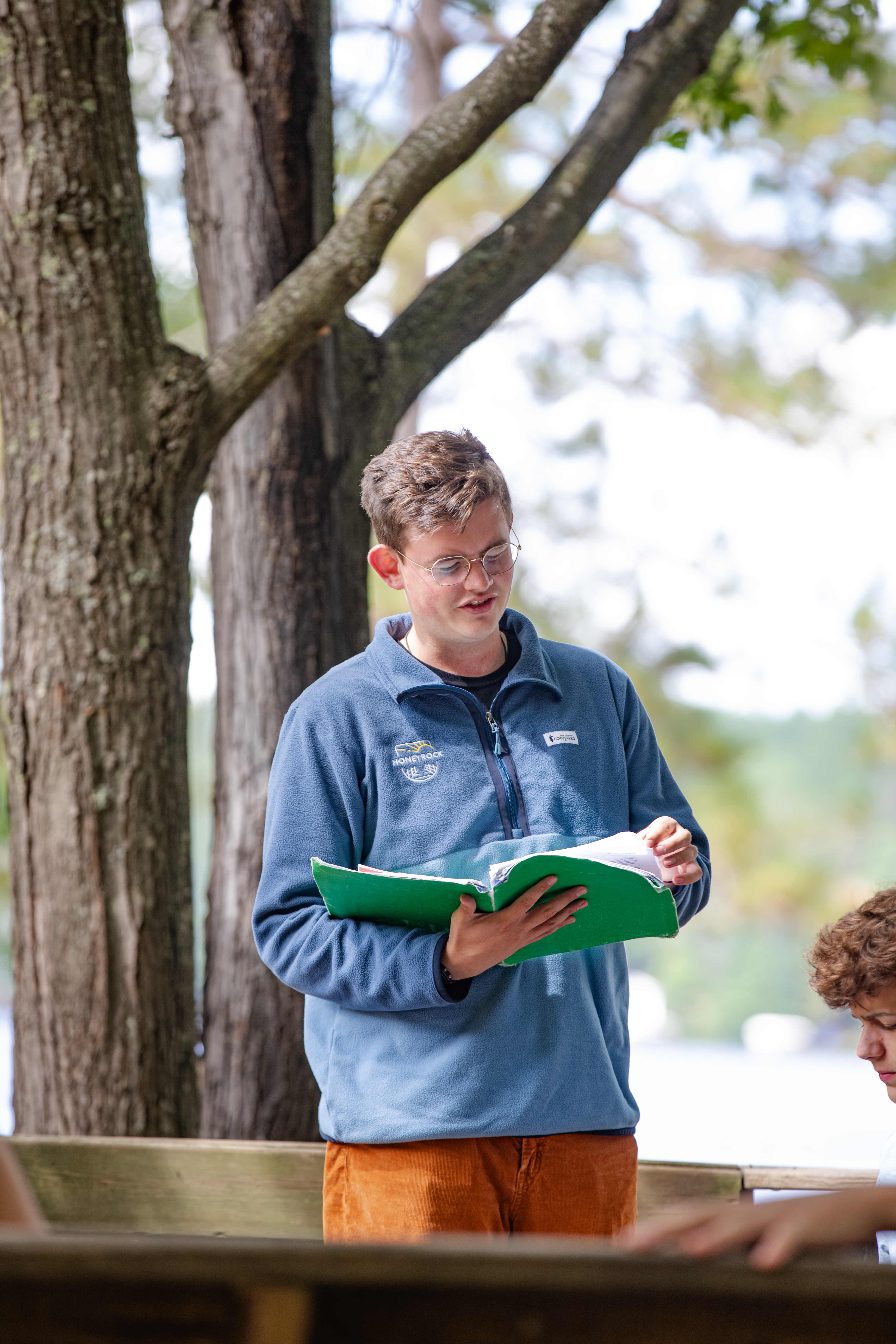 A College student holding a bible 
