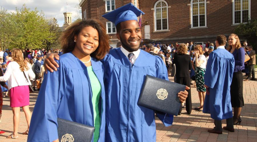 Two graduates at Undergraduate Commencement Wheaton College IL