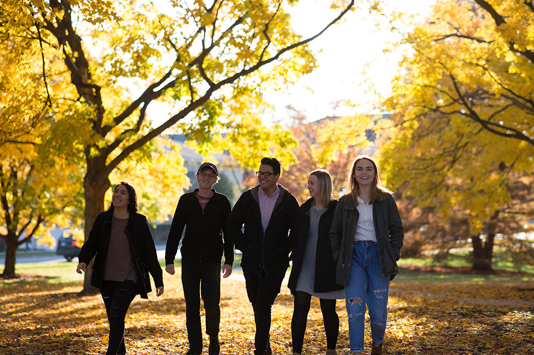 Students walking in autumn on Wheaton College campus