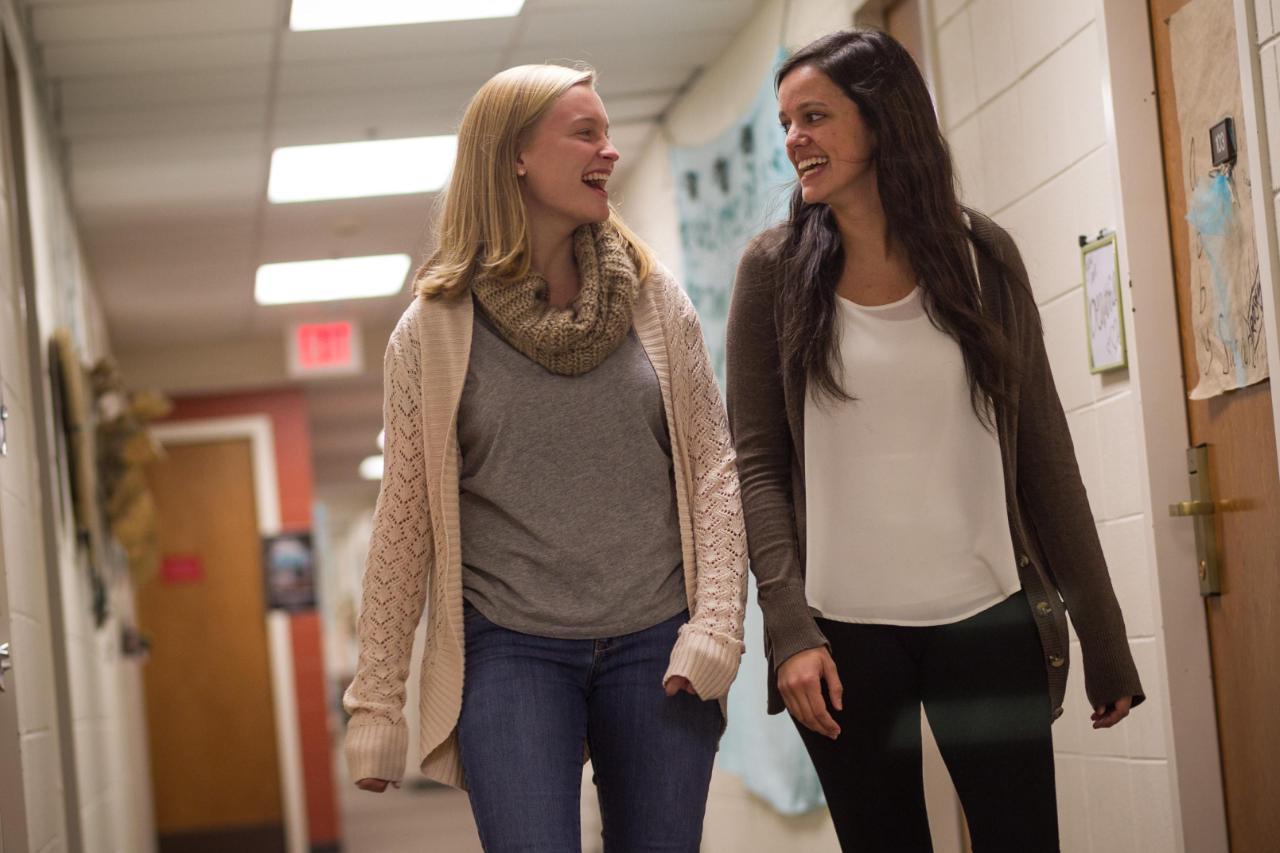 Two Female Wheaton College Students walking down the hall