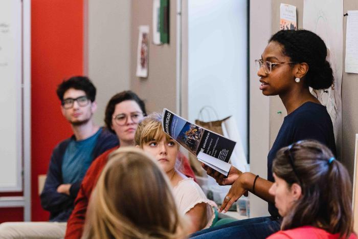 student speaking in class at wheaton