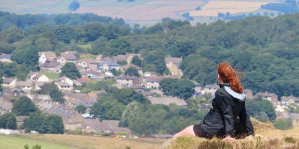 Student Looking Over English Countryside on Wheaton in England