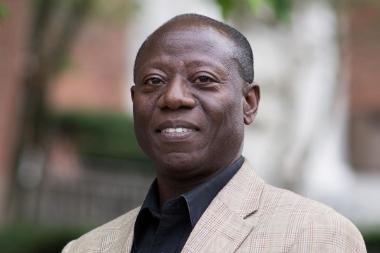 A black man smiles
