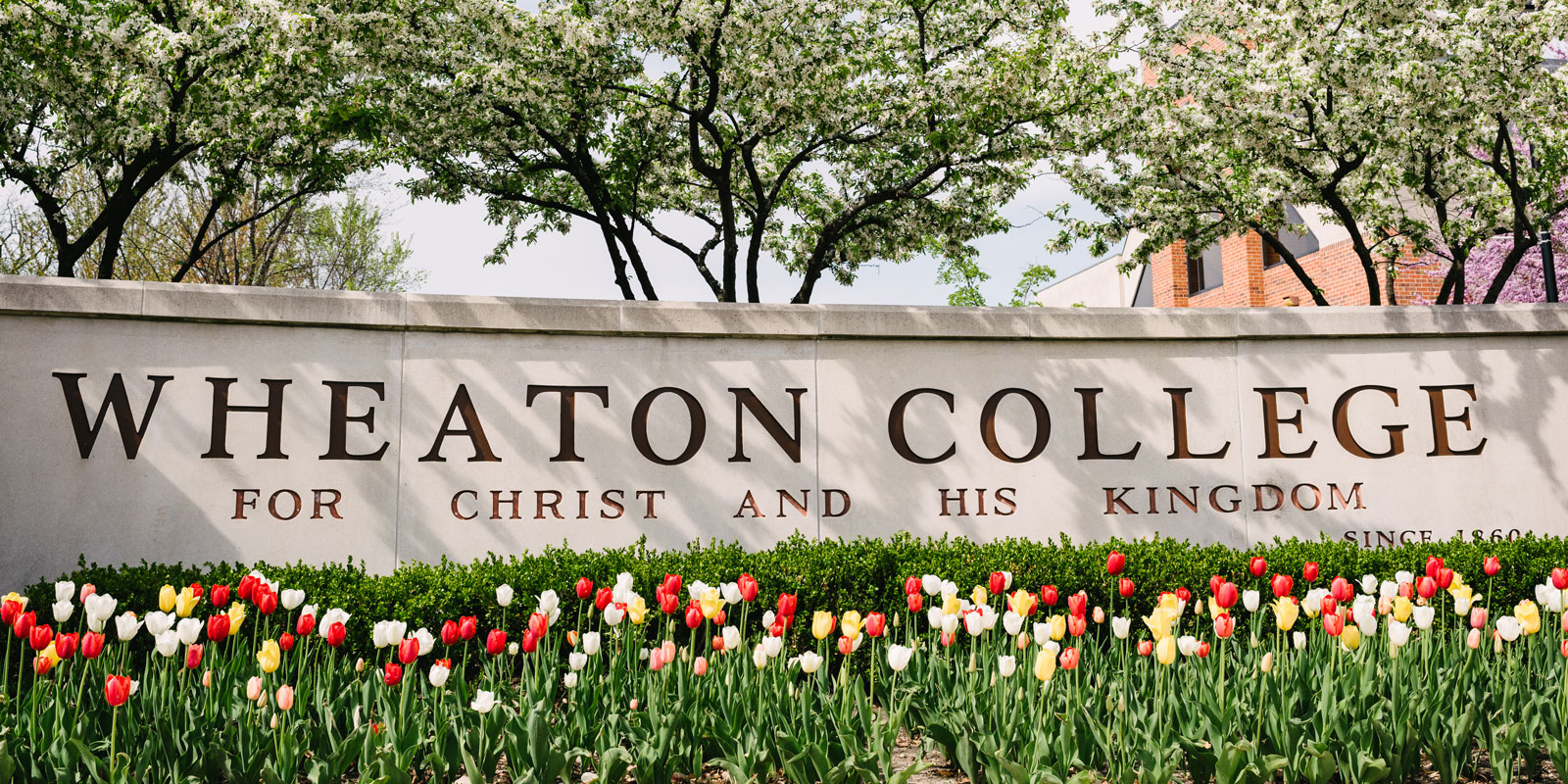 Wheaton College Sign with Flowers