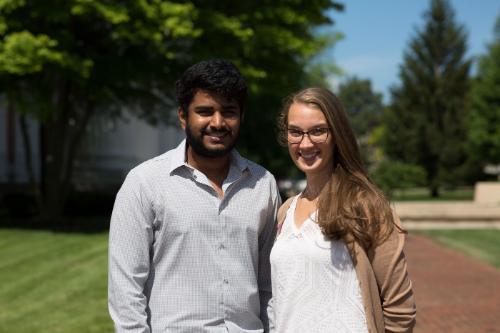 Students outside smiling