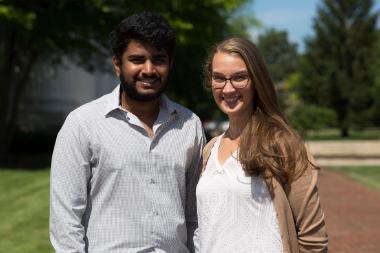 Students outside smiling