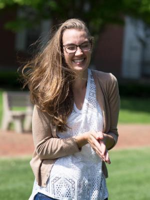 Student outside smiling