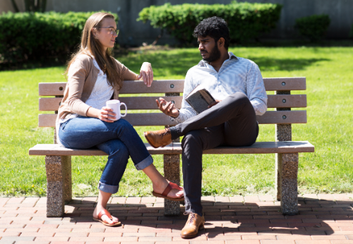 students sitting on a bench