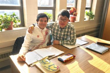 Two students studying in the Buswell Library