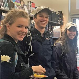 3 students eating snacks