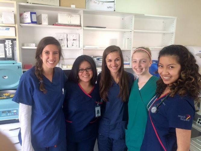 5 girls in scrubs in medical setting