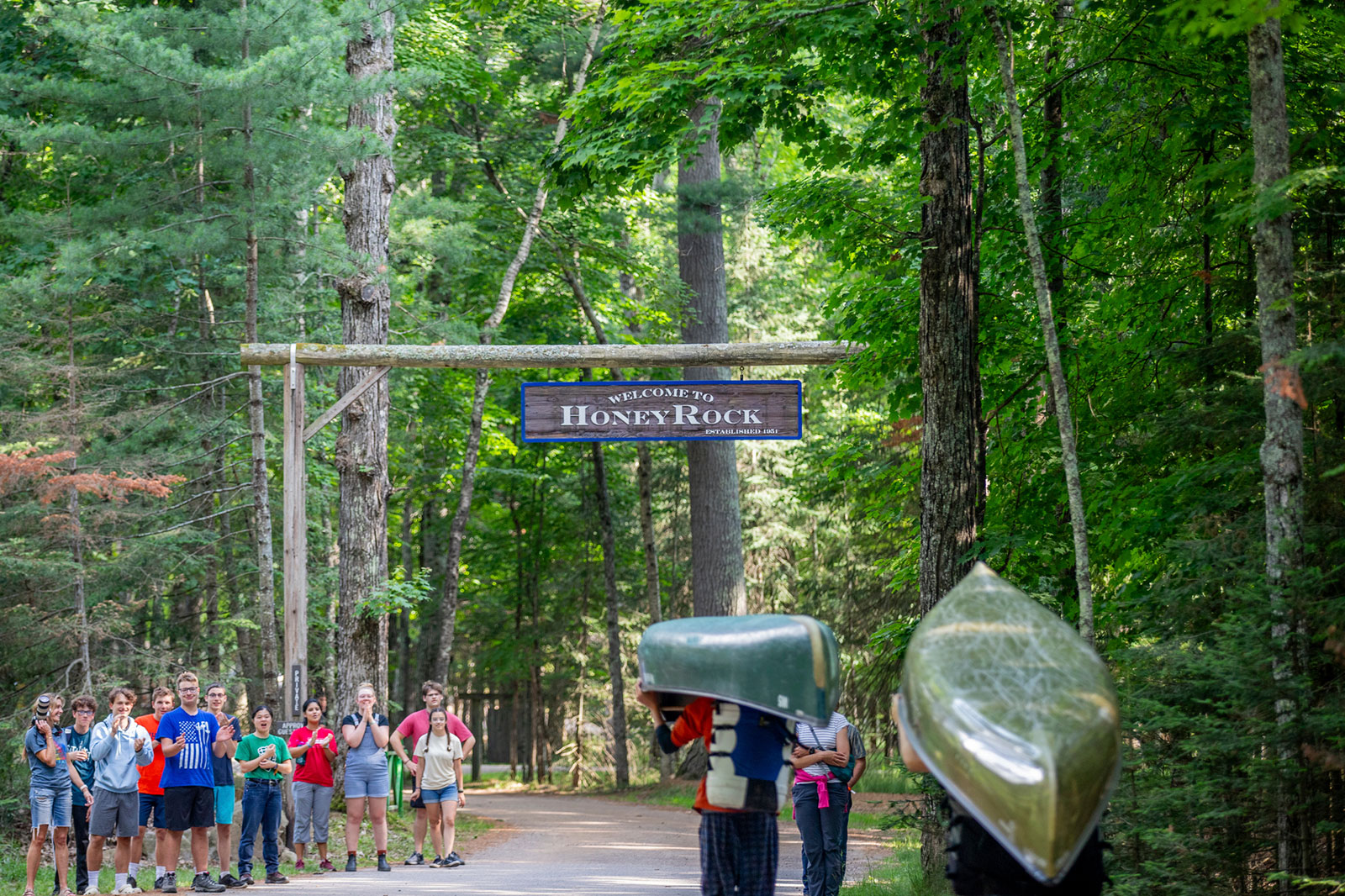 People taking canoes back to camp