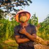 Man in mask in field