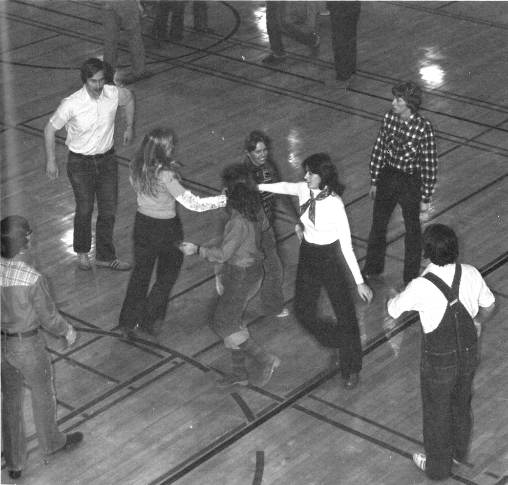1976, Students dance in a ladies chain (a common square dancing call) at the College Union–sponsored square dance.