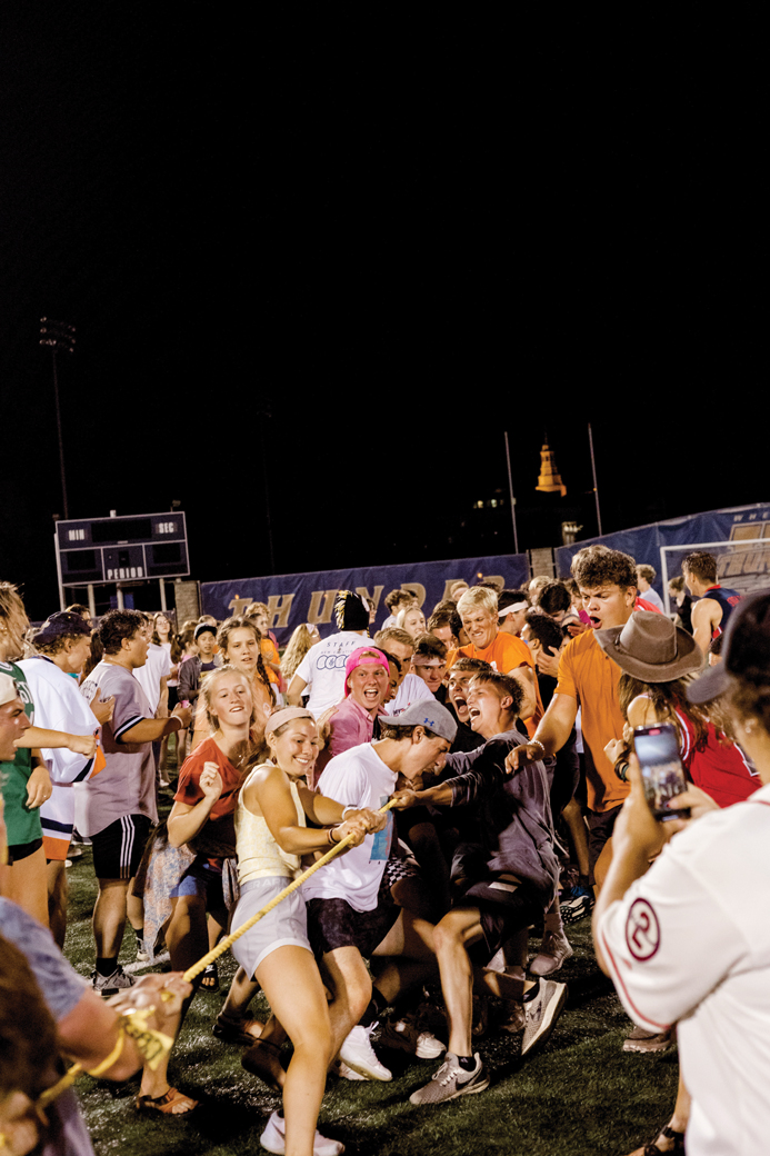 Wheaton College IL Students compete in tug-of-war competitions at Orientation 2022’s rec night in Joe Bean stadium.