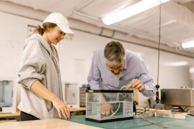 Wheaton College IL undergraduate engineering major and professor working in campus lab