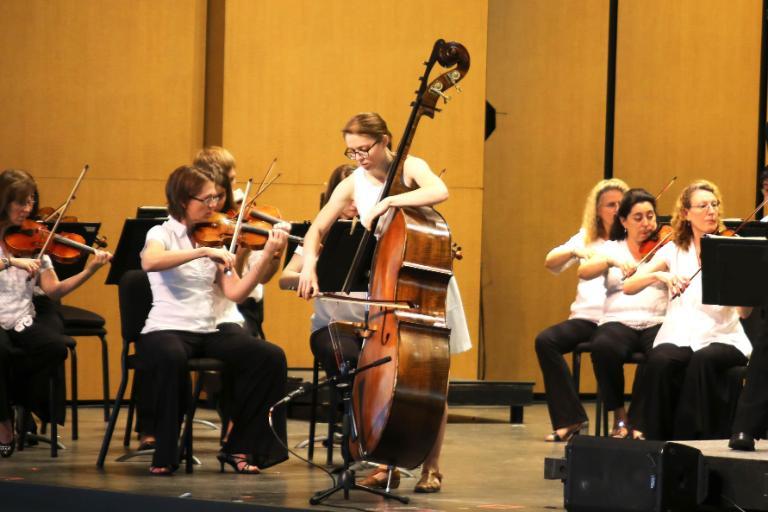 Wheaton College IL Conservatory of Music alumna Hannah Novak performs bass solo with orchestra