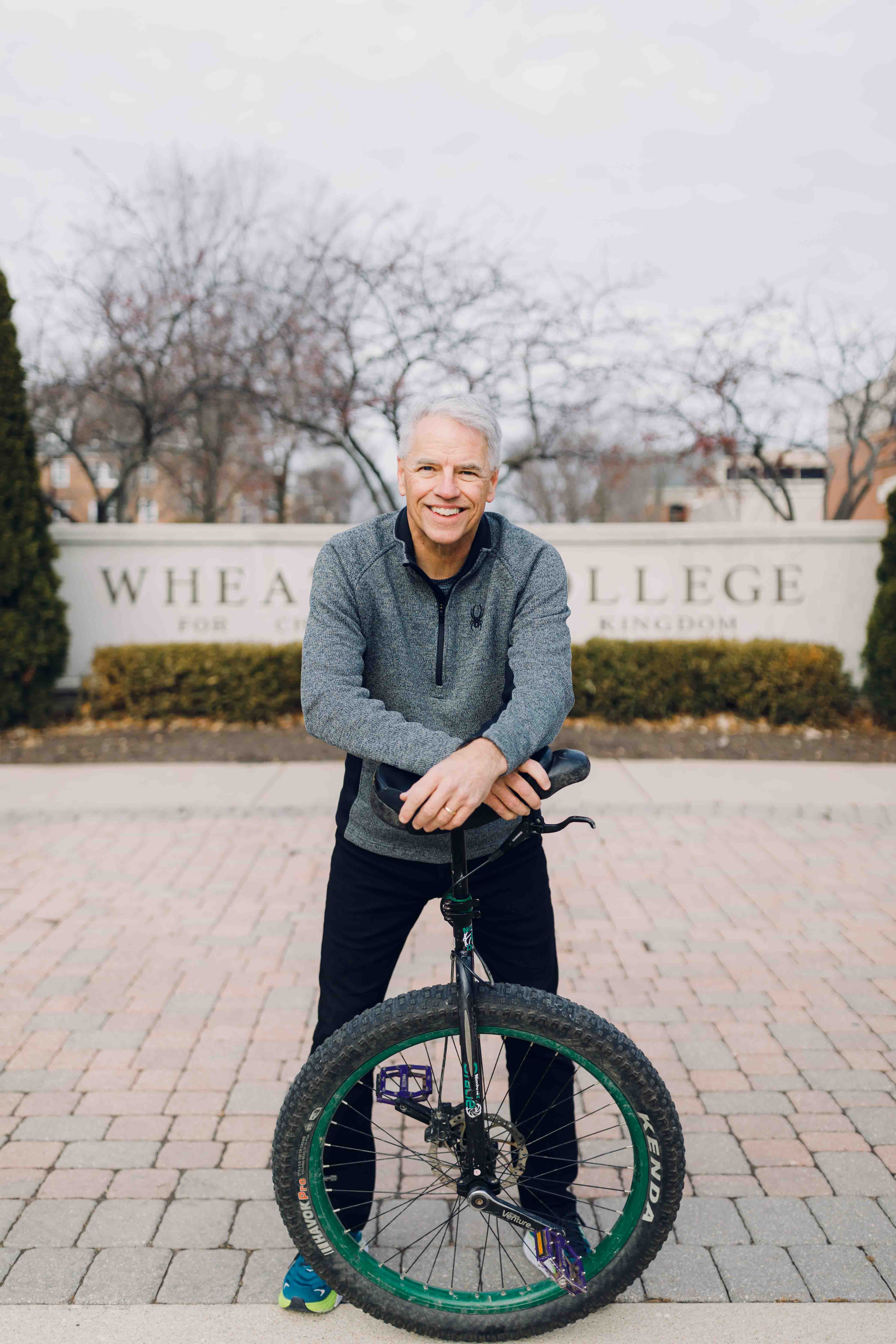Wheaton College IL Bob O'Connor with Unicycle