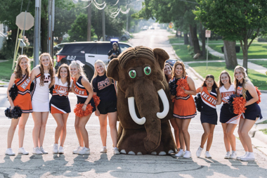 Wheaton College IL mascot Tor with Thunder cheerleaders