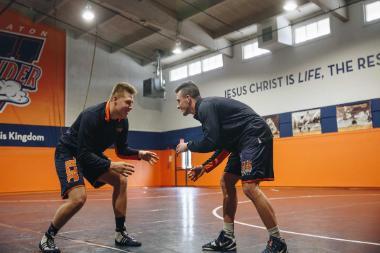 Two Wrestlers in Pete Willson Wrestling Room at Wheaton College IL