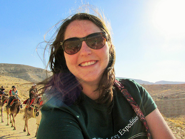 Sarah Ostertag riding a camel during her trip to Israel