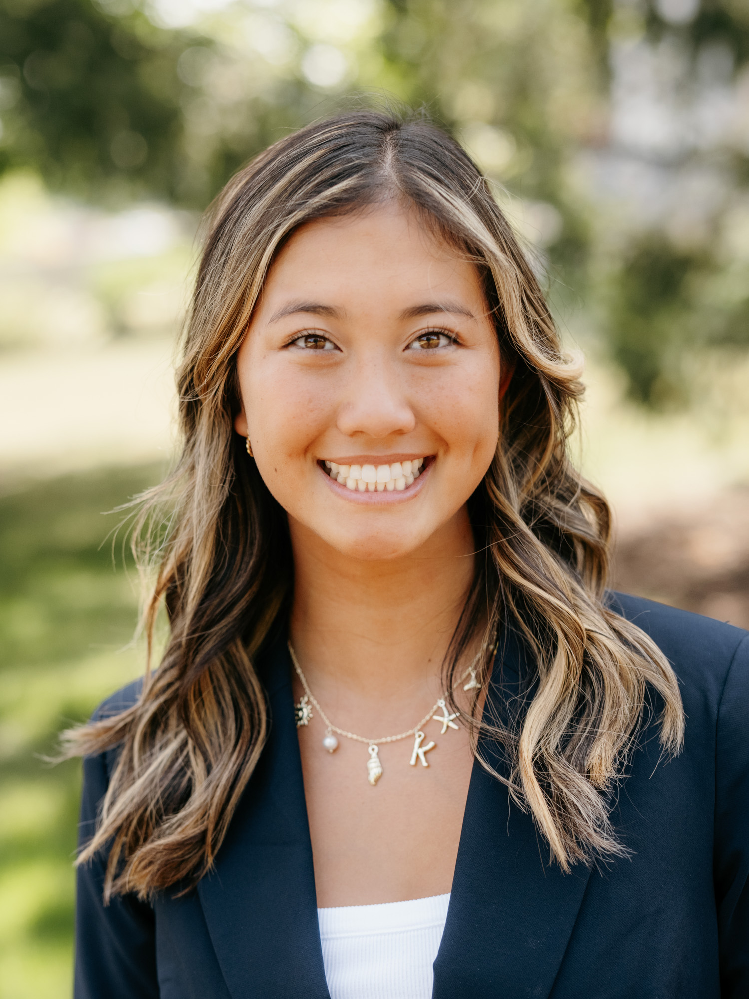 An asian female smiles
