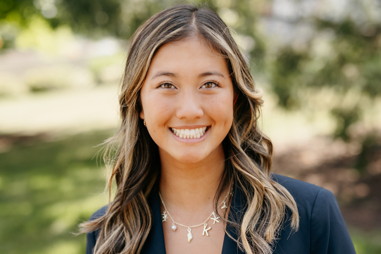 An asian female smiles