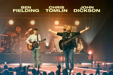 Two white men holding guitars stand on a stage. Above them three names are listed: Ben Fielding, Chris Tomlin, and John Dickson.