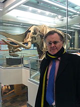 Dr. Hedley standing in front of the Perry Mastadon