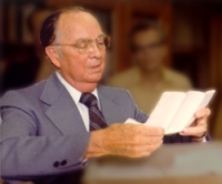 Clyde Kilby examining materials at the Wade Center, 1981