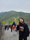 female student standing on the Great Wall of China