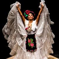 Latin American Woman in traditional clothing dancing