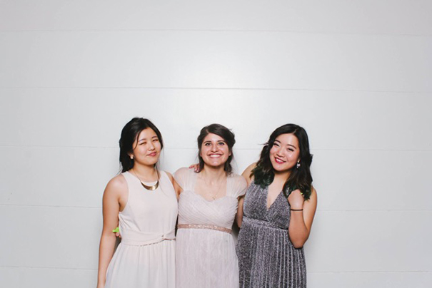 3 girls smiling formally dressed