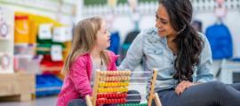 Teacher and special ed student in classroom